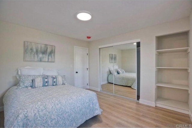 bedroom with wood-type flooring