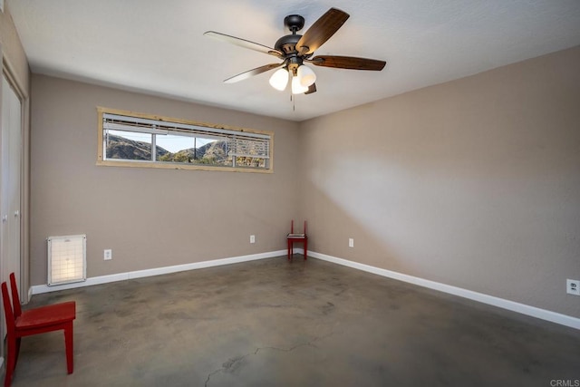 spare room with ceiling fan