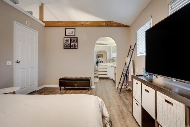 bedroom with lofted ceiling and light hardwood / wood-style floors