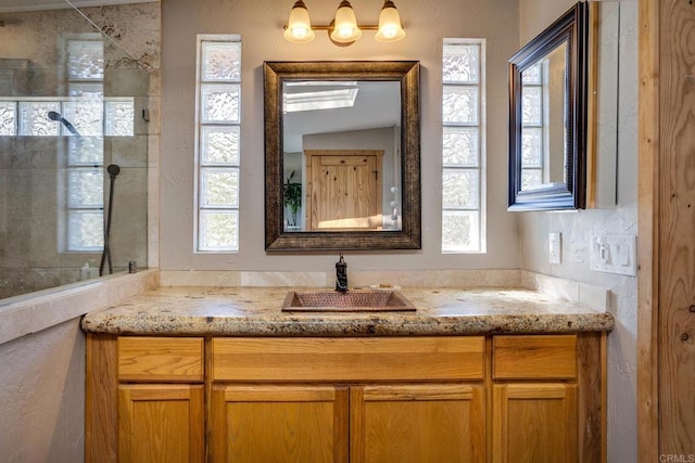 bathroom featuring vanity and walk in shower