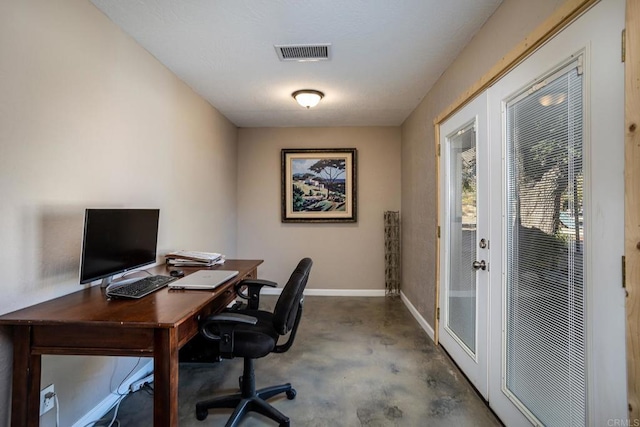 office area featuring concrete flooring and french doors