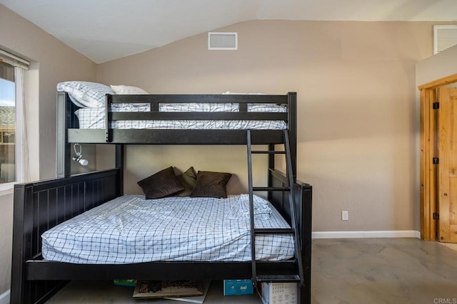 bedroom featuring lofted ceiling