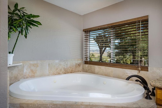 bathroom with tiled tub