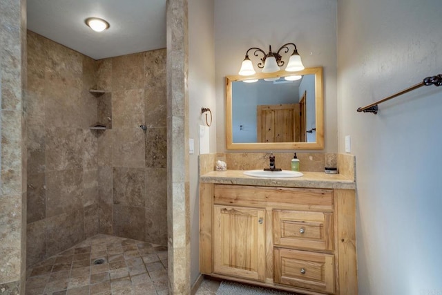 bathroom featuring vanity and tiled shower