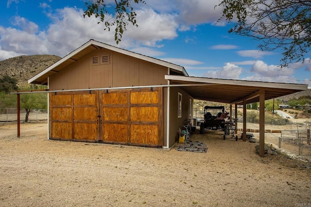 view of outbuilding with a mountain view