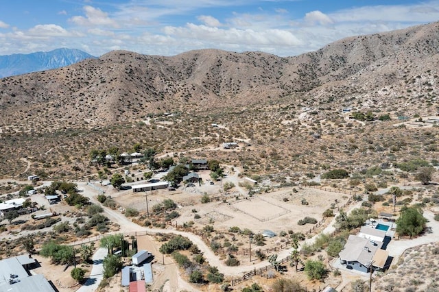 birds eye view of property with a mountain view