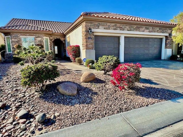 mediterranean / spanish-style home featuring a garage