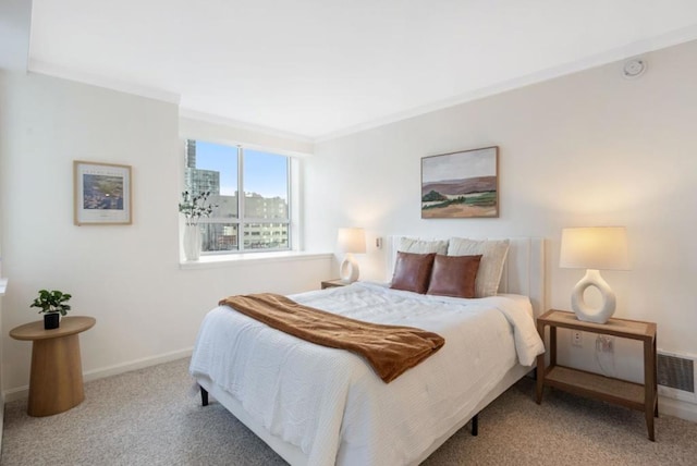 carpeted bedroom with crown molding