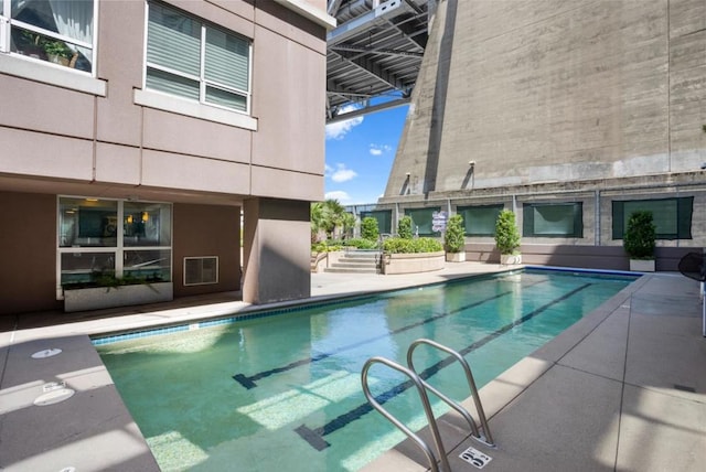 view of swimming pool featuring a patio