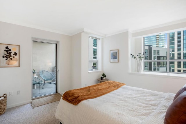 bedroom featuring access to exterior, light colored carpet, and crown molding