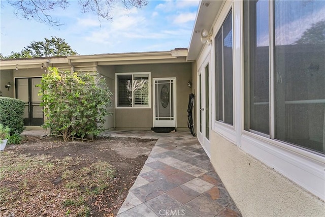 property entrance with a patio