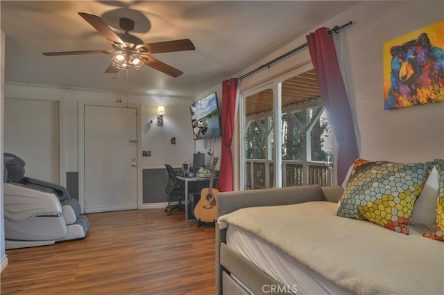 bedroom featuring hardwood / wood-style flooring, access to exterior, and ceiling fan