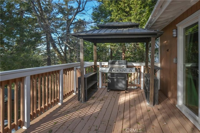 wooden terrace featuring a gazebo and grilling area