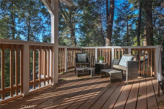 wooden terrace with outdoor lounge area