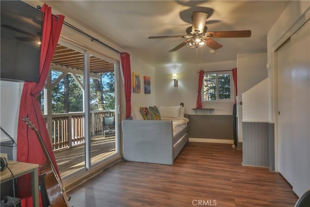 interior space featuring ceiling fan and dark wood-type flooring