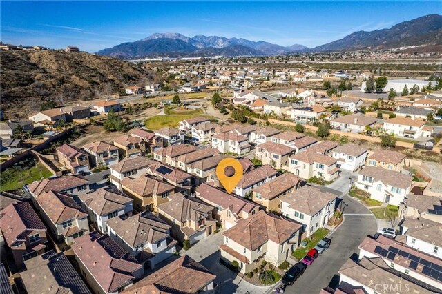 birds eye view of property with a mountain view