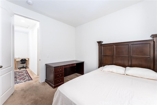 bedroom featuring light colored carpet