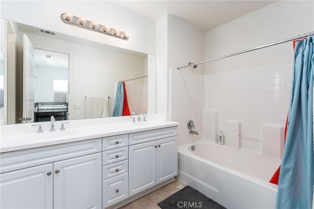 bathroom featuring vanity, shower / bath combination with curtain, and tile patterned floors