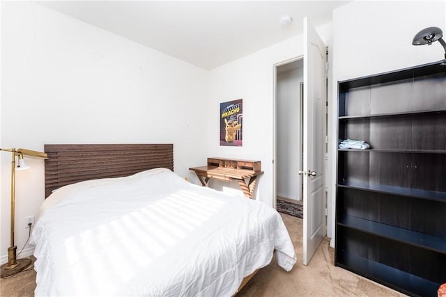 bedroom with light colored carpet