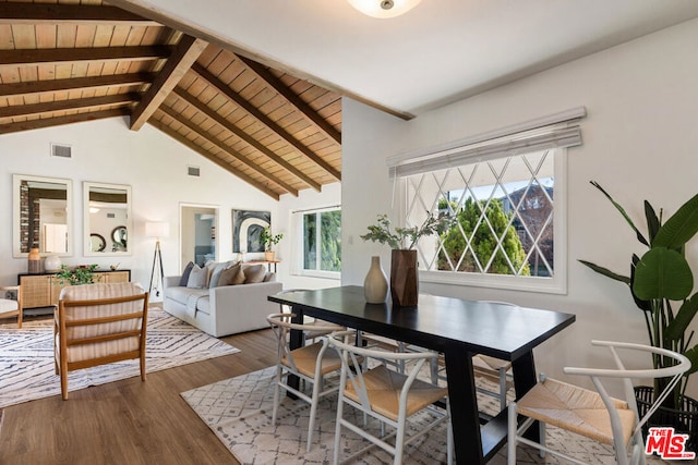 dining space featuring wooden ceiling, hardwood / wood-style floors, and vaulted ceiling with beams