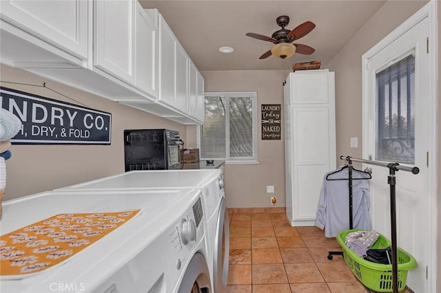 washroom featuring ceiling fan, cabinets, washer and clothes dryer, and light tile patterned flooring