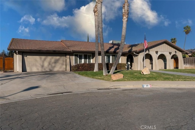 view of front of home with a garage and a front yard