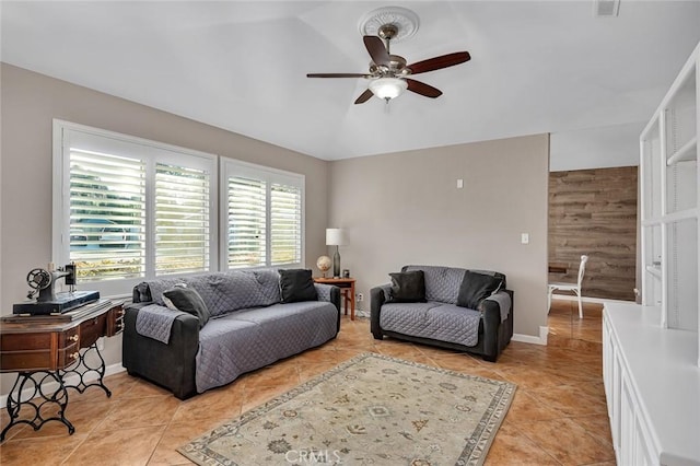 living room featuring ceiling fan and light tile patterned flooring