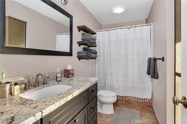 bathroom with toilet, tile patterned floors, a shower with shower curtain, and vanity