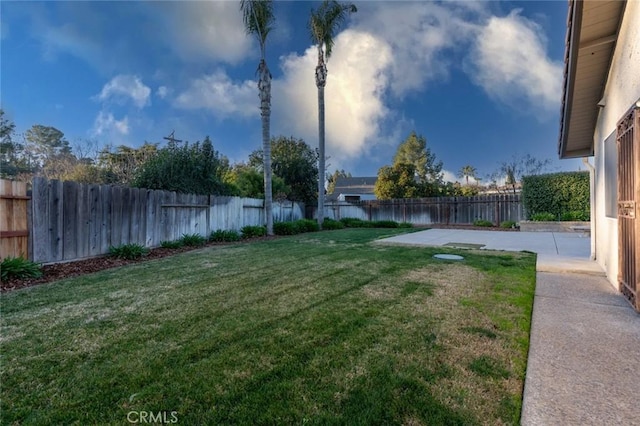 view of yard featuring a patio and a water view