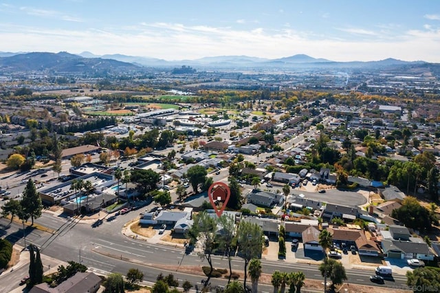 birds eye view of property with a mountain view