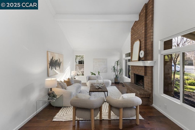 living room featuring dark hardwood / wood-style floors, a fireplace, beam ceiling, and high vaulted ceiling