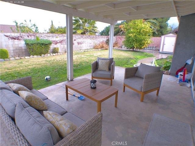 view of patio featuring a storage shed and an outdoor living space