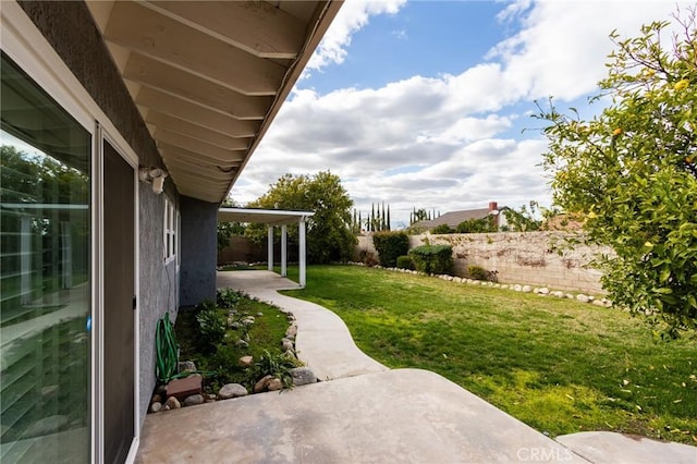 view of yard featuring a patio area and fence