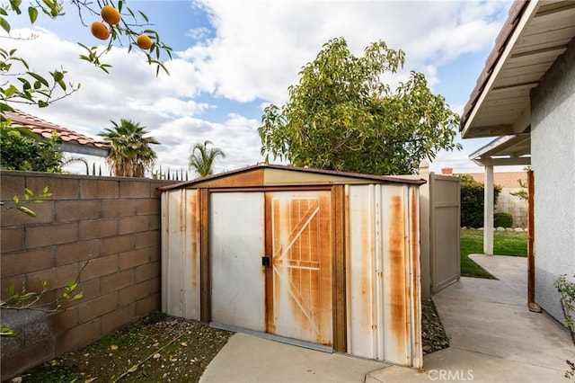 view of shed with a fenced backyard