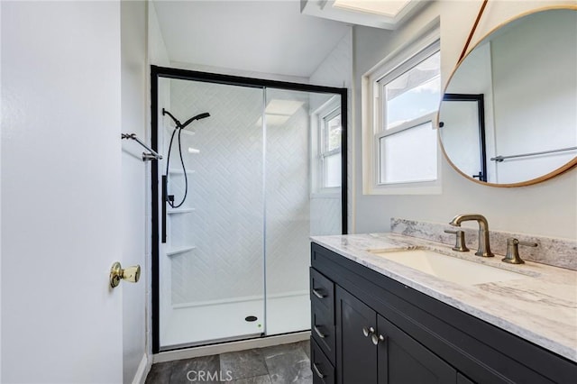 bathroom featuring a shower stall and vanity