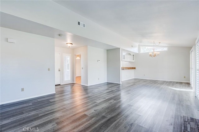 unfurnished living room featuring lofted ceiling, visible vents, a chandelier, and dark wood finished floors