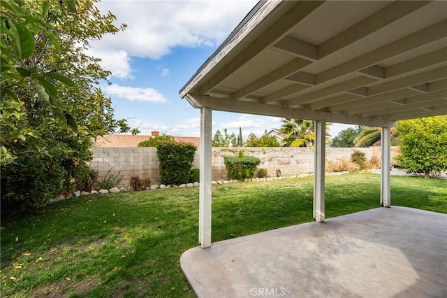 view of yard featuring a patio area and fence