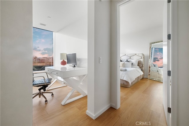 bedroom with light hardwood / wood-style floors