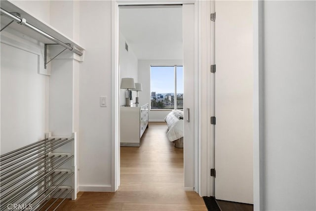 hallway with light wood-type flooring