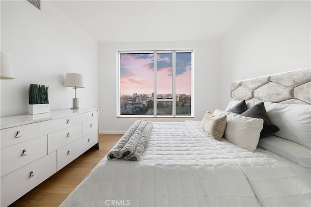 bedroom with light hardwood / wood-style flooring