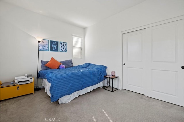 carpeted bedroom featuring a closet