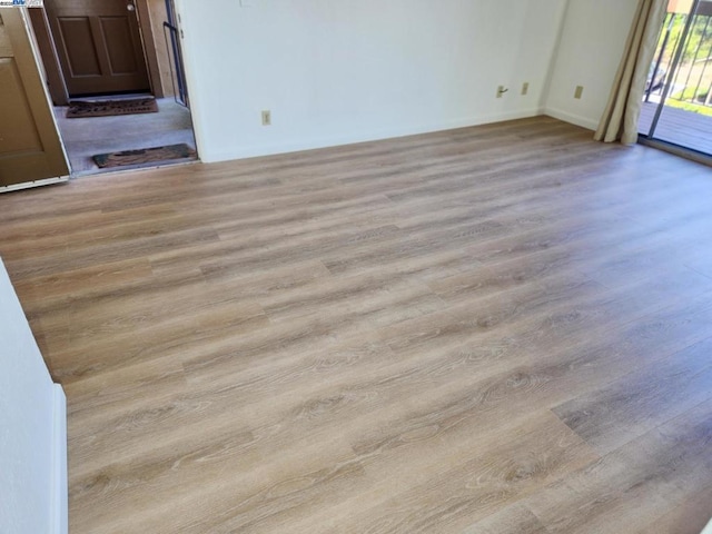 spare room with light wood-type flooring