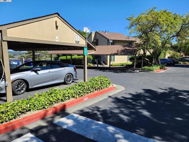 view of car parking featuring a carport