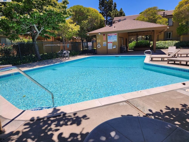 view of swimming pool featuring a patio area