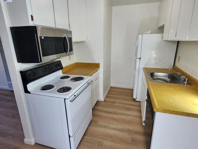 kitchen featuring white cabinetry, black dishwasher, sink, electric range, and light hardwood / wood-style flooring