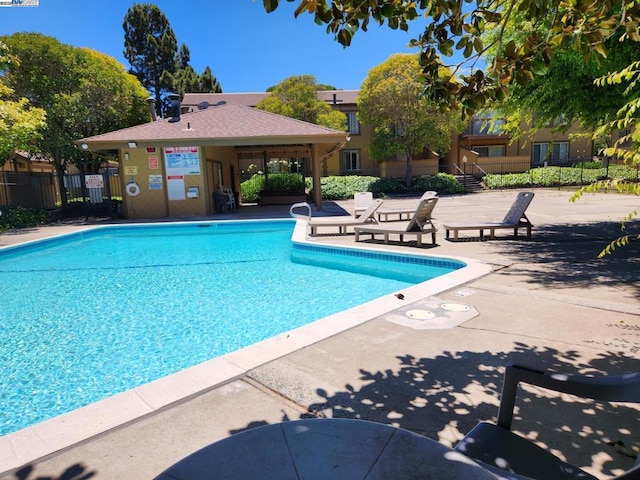 view of swimming pool with a patio