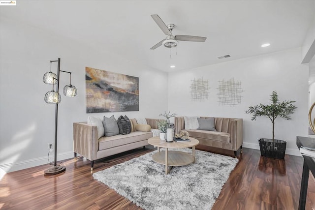 living room with ceiling fan and dark hardwood / wood-style flooring