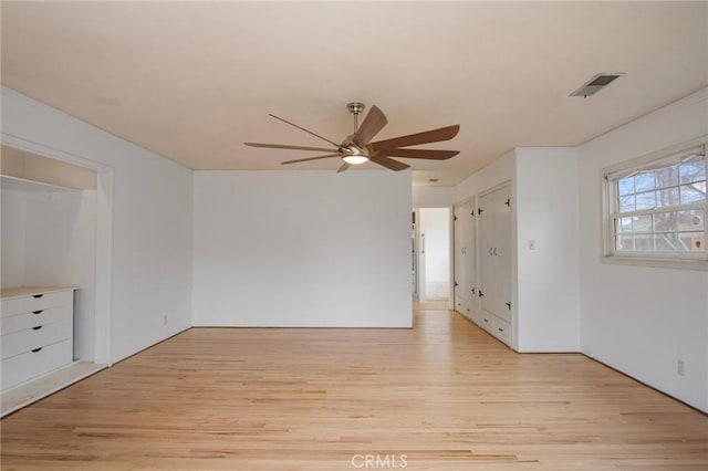 unfurnished room featuring ceiling fan and light hardwood / wood-style floors