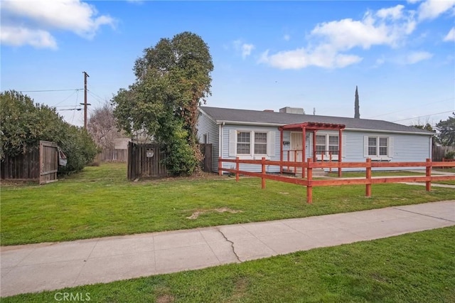 ranch-style home with a front lawn