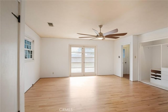 interior space with light hardwood / wood-style flooring and ceiling fan